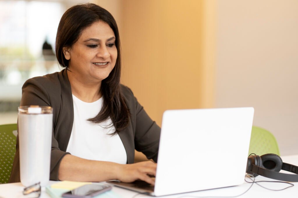 Woman smiling while attending a personalized Swedish course online